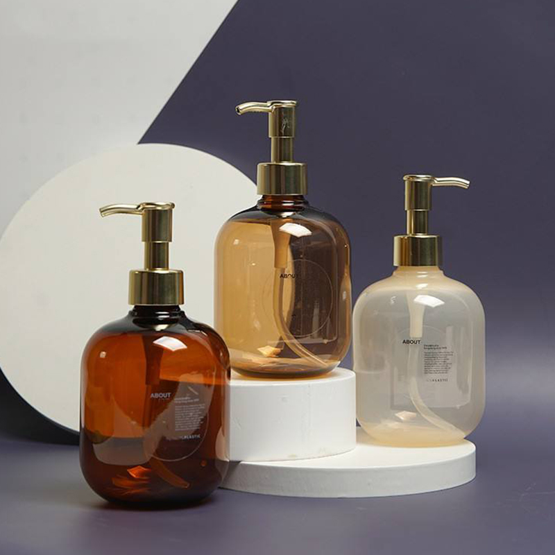 300 ml 500 ml PET műanyag borostyánsárga kerek üres balzsam testápoló palack arany PET krém pumpás samponos flakon
